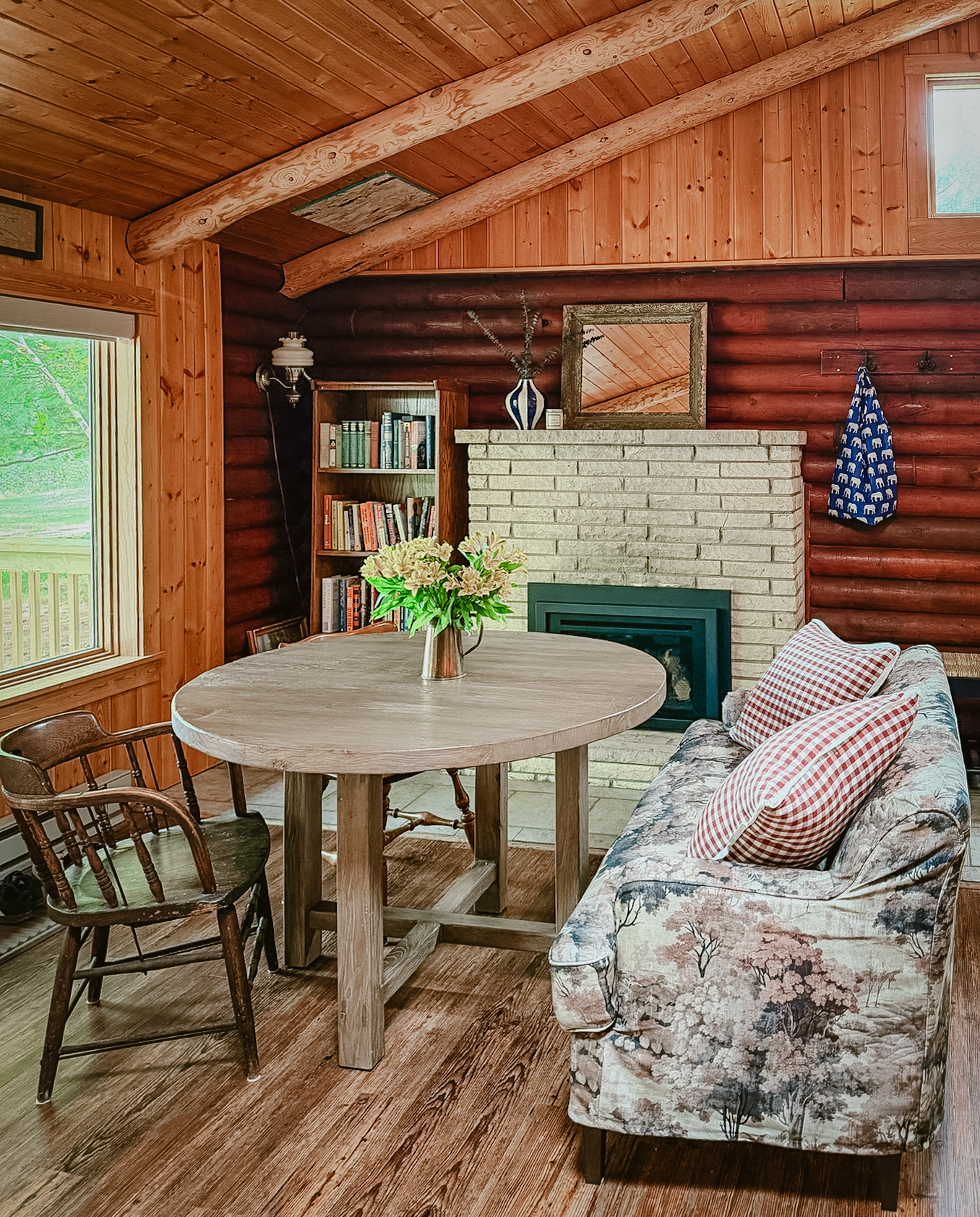 The dining nook beside the gas fireplace and bookshelf